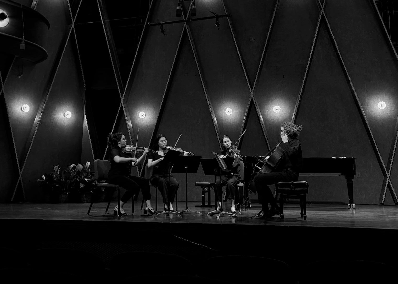 Jody Middleton performing in a string quartet on stage